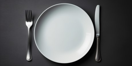 Fork lies on an empty plate instead of food , concept of Deprivation, created with Generative AI technology